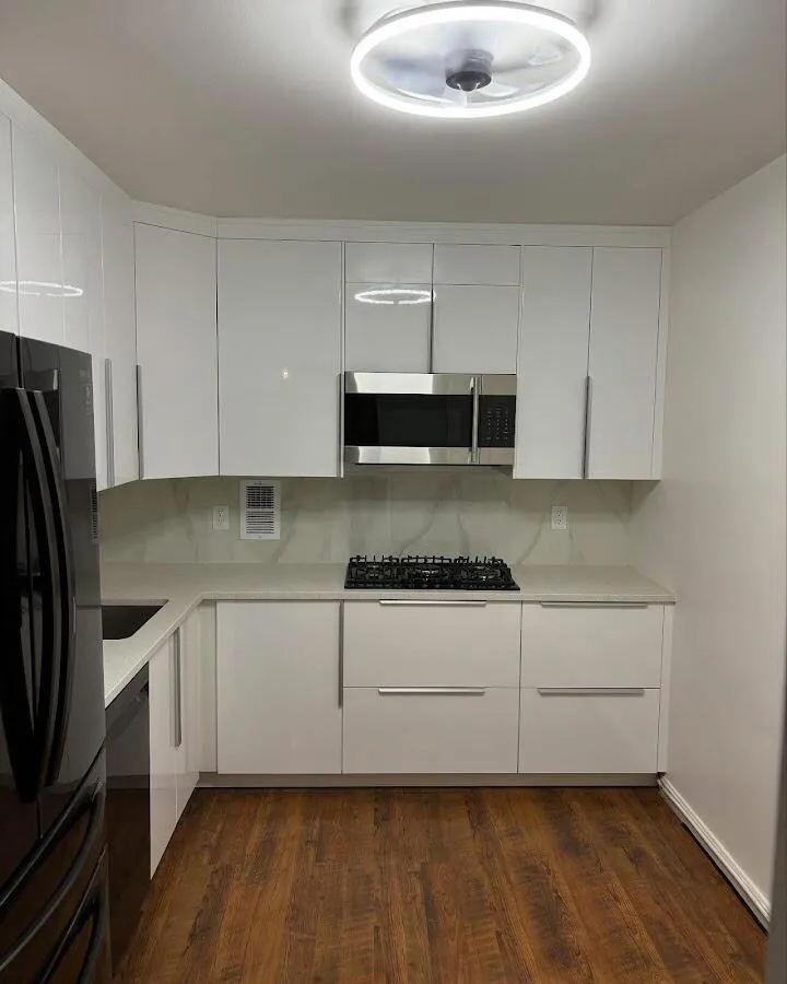 Renovated kitchen with quartz countertops in Brookline